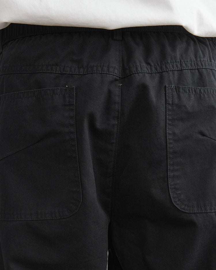 Avslappnade byxor med elastiskt midjeband och jeansliknande look