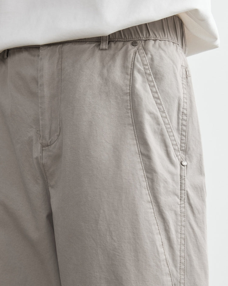 Avslappnade byxor med elastiskt midjeband och jeansliknande look