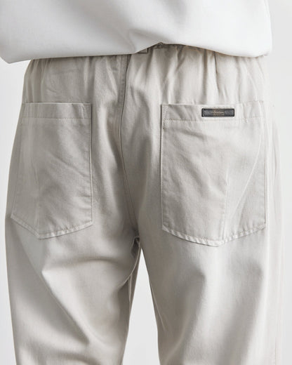 Baggy byxor med elastiskt midjeband och jeansliknande
