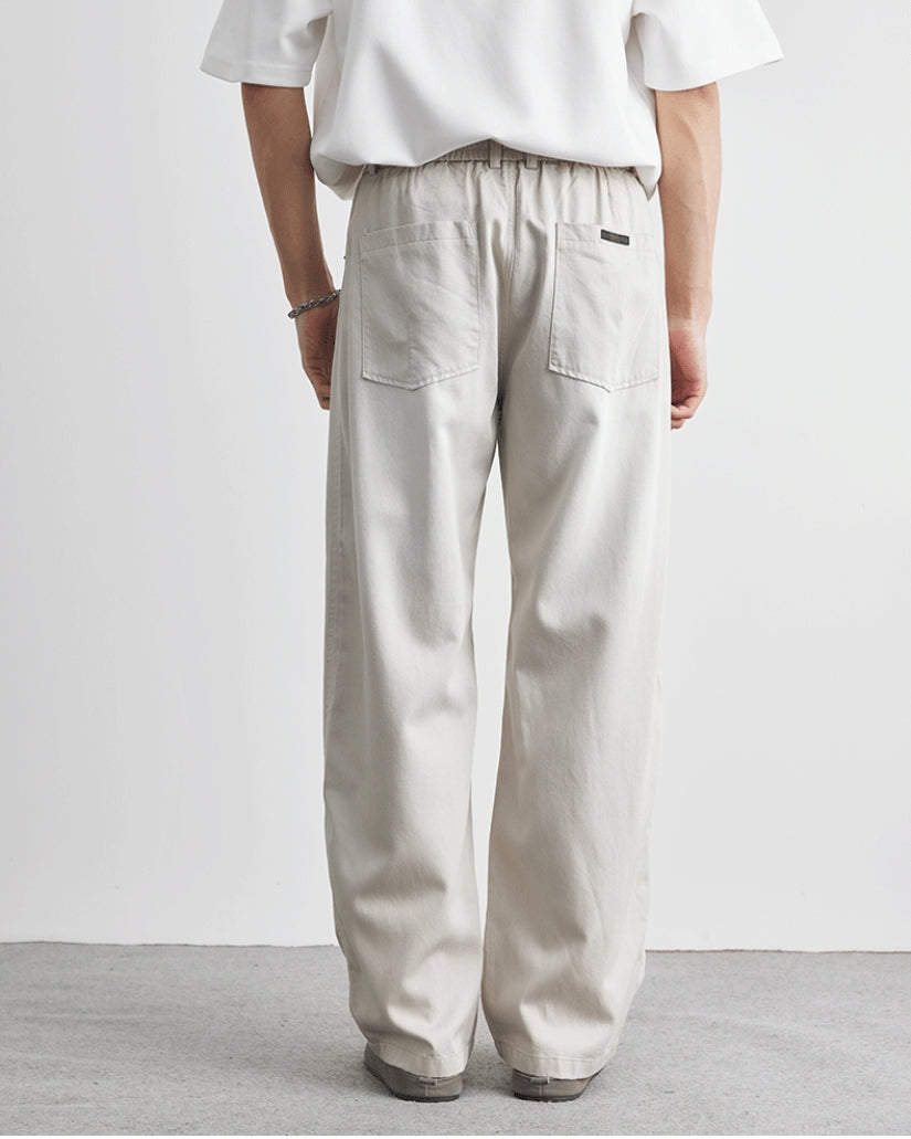 Baggy byxor med elastiskt midjeband och jeansliknande
