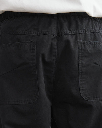 Avslappnade byxor med elastiskt midjeband och jeansliknande look